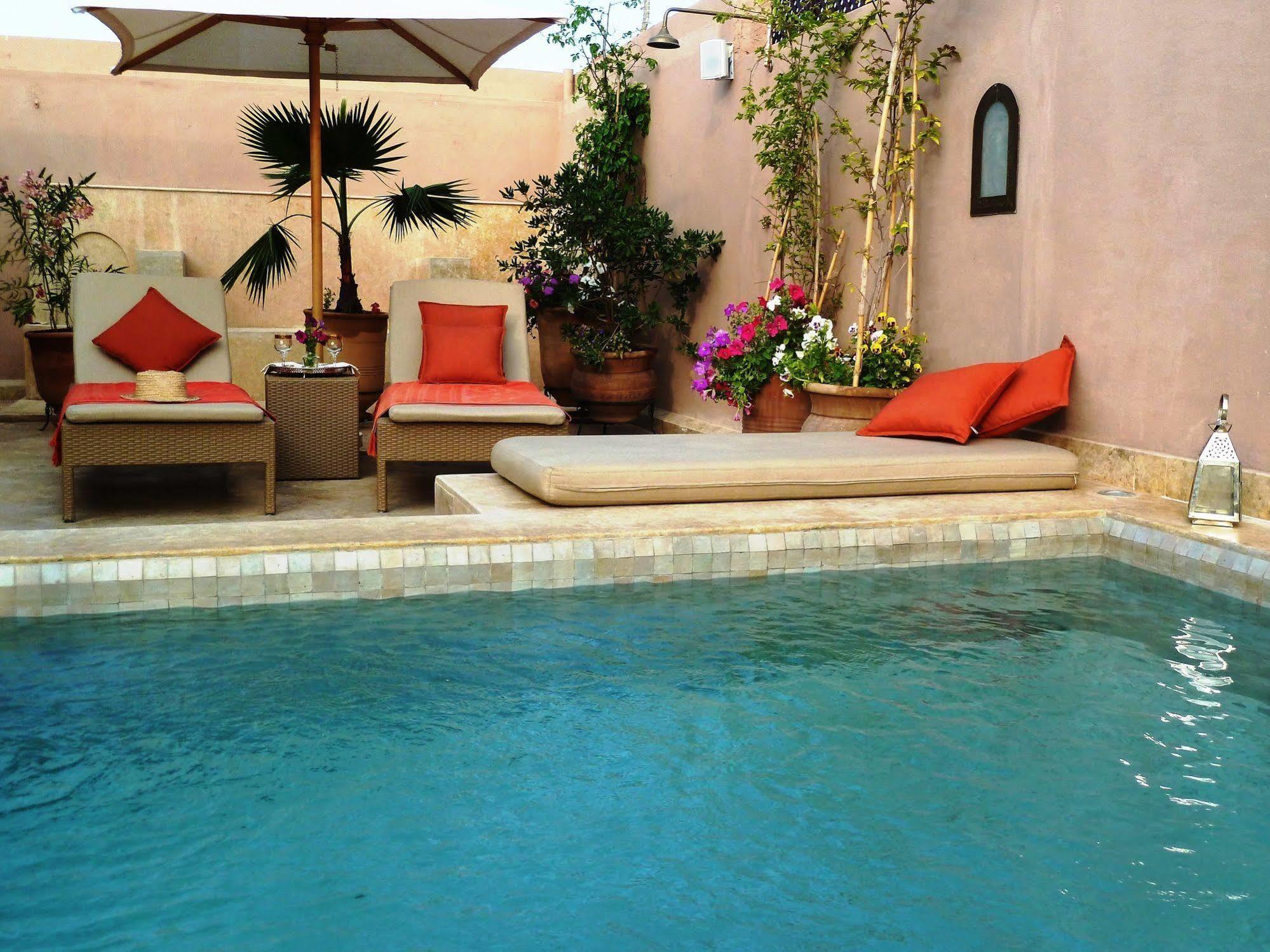 Riad Viva Марракеш Экстерьер фото A swimming pool in Morocco